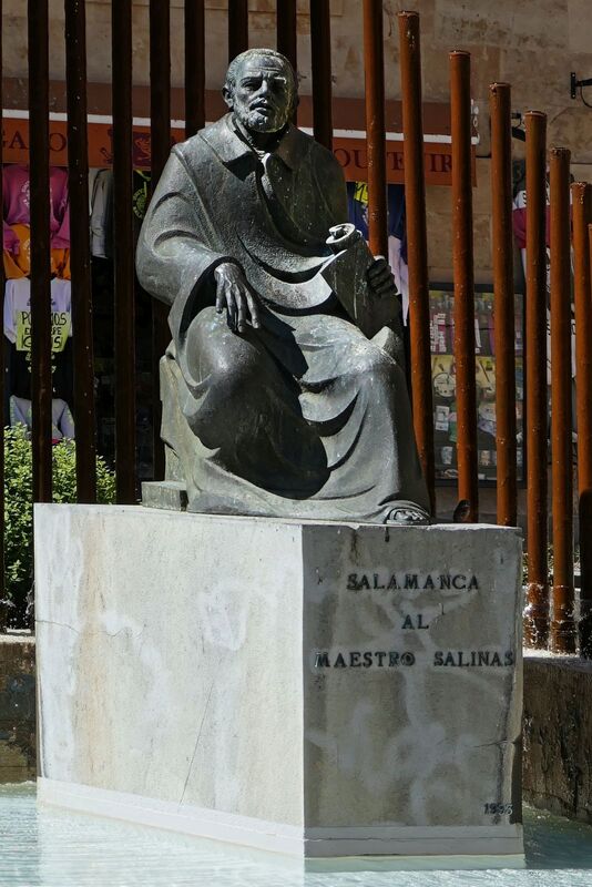 DC 22-0794-168.jpg :: Saga Douro River Cruise, Salamanca. Spain: The Monumento al Maestro Salinas (Monument to Maestro Salinas). The bronze sculpture, created by Hipólito Pérez Calvo and inaugurated in 1993, honours the life and work of Francisco de Salinas, a renowned 16th-century Spanish music theorist and organist. The statue depicts Francisco de Salinas, who became blind at age eleven but went on to become a famous musician and a professor of music at the University of Salamanca for over 20 years. The monument is situated in a triangular square at the intersection of Rúa Antigua, Rúa Mayor, and Calle Compañía. It is next to other significant landmarks, including the historic Casa de las Conchas and the Clerecía church (Pontifical University building). Photo taken 01/09/2022