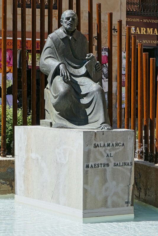 DC 22-0794-170.jpg :: Saga Douro River Cruise, Salamanca. Spain: The Monumento al Maestro Salinas (Monument to Maestro Salinas). The bronze sculpture, created by Hipólito Pérez Calvo and inaugurated in 1993, honours the life and work of Francisco de Salinas, a renowned 16th-century Spanish music theorist and organist. The statue depicts Francisco de Salinas, who became blind at age eleven but went on to become a famous musician and a professor of music at the University of Salamanca for over 20 years. The monument is situated in a triangular square at the intersection of Rúa Antigua, Rúa Mayor, and Calle Compañía. It is next to other significant landmarks, including the historic Casa de las Conchas and the Clerecía church (Pontifical University building). Photo taken 01/09/2022