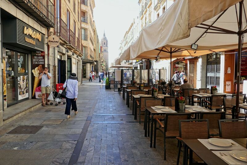 DC 22-0794-174.jpg :: Saga Douro River Cruise, Salamanca. Spain: View down the Rúa Mayor, a pedestrian street in the historic centre of Salamanca. The street leads toward the bell tower of the city's cathedral complex. The street is lined with historic buildings, shops, and outdoor cafes (tapas bars). Photo taken 01/09/2022