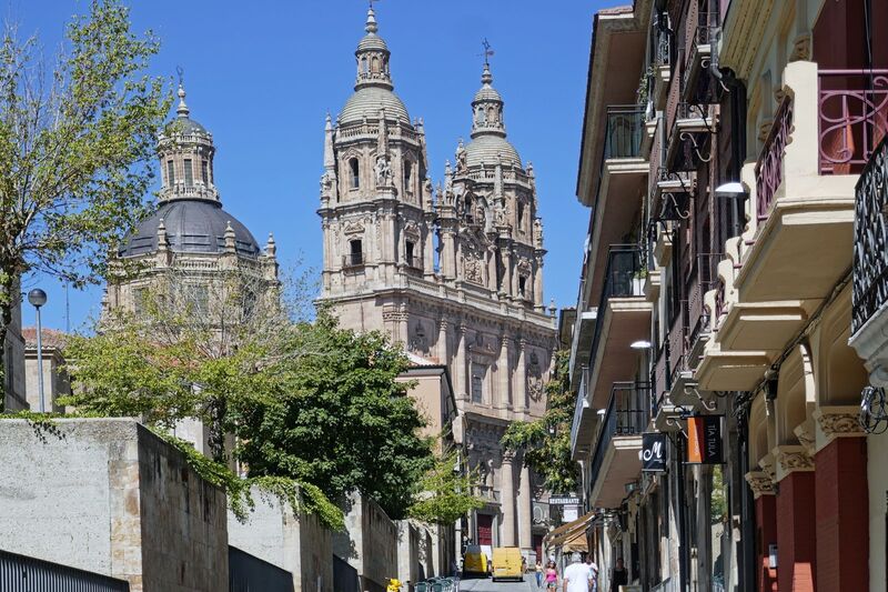DC 22-0794-180.jpg :: Saga Douro River Cruise, Salamanca. Spain: La Clerecía, a significant historic monument located in Salamanca, Spain. Originally built as the Royal College of the Society of Jesus, it now serves as the headquarters for the Pontifical University of Salamanca. La Clerecía is a stunning example of Spanish Baroque architecture. Construction began in 1617 and was finally completed in 1754. The imposing façade, grand church, and three-story Baroque cloister are notable features. Visitors can climb the church towers, an experience known as the \