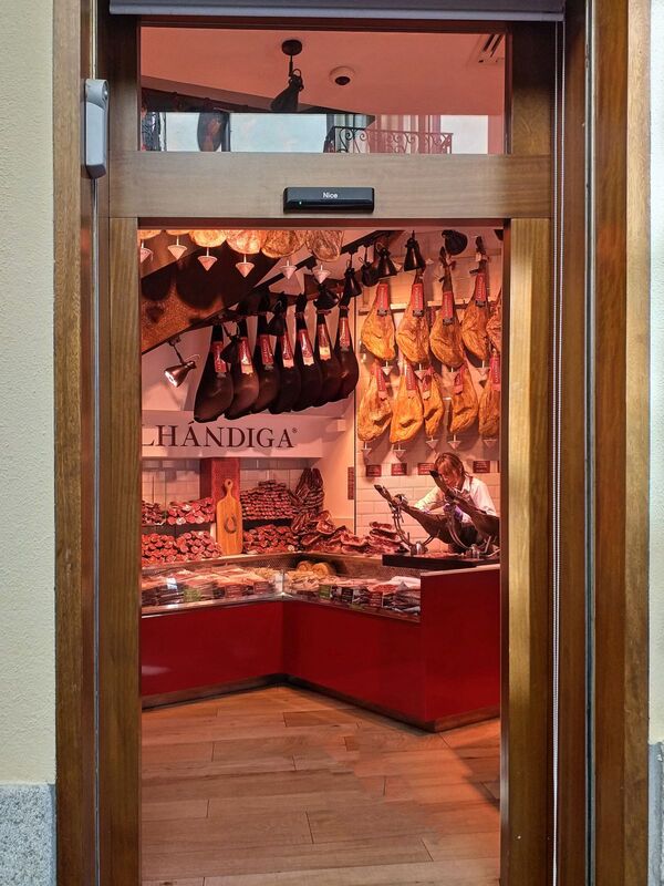 DC 22-0794-190.jpg :: Saga Douro River Cruise, Salamanca. Spain: Alhándiga, Iberian ham store outlet in Plaza del Corrillo. Photo taken 01/09/2022