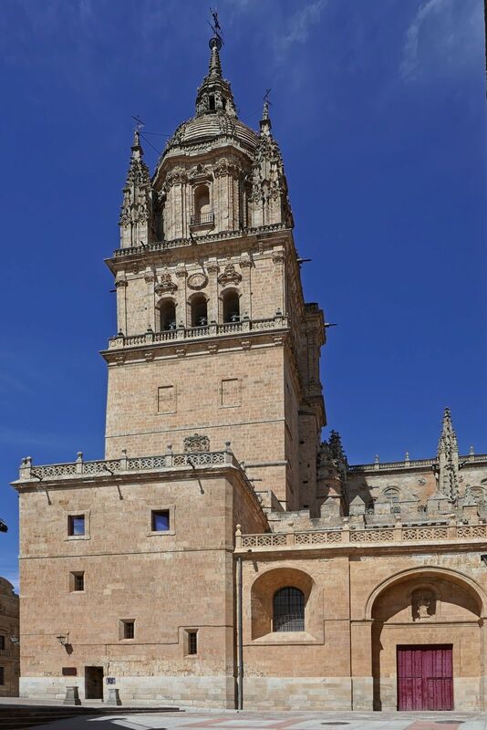 DC 22-0794-192.jpg :: Saga Douro River Cruise, Salamanca. Spain: The Old Cathedral of Salamanca (Catedral Vieja de Santa María). It is one of two cathedrals in the city, situated adjacent to the New Cathedral of Salamanca. Construction began in the 12th century and was completed in the 14th century, featuring a blend of Romanesque and Gothic architectural styles. The cathedral is dedicated to Santa Maria de la Sede. A notable exterior feature is the Romanesque-Byzantine-style dome known as the \