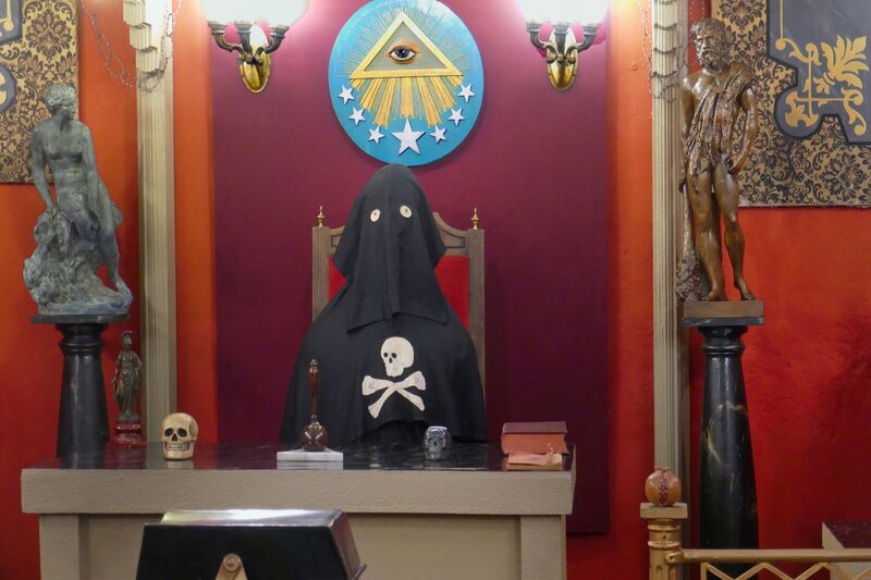 DC 22-0794-198.jpg :: Saga Douro River Cruise, Salamanca. Spain: A recreation of a Masonic Lodge at the General Archive of the Spanish Civil War in Salamanca, Spain. The exhibit provides insight into Freemasonry, which is one of the world's oldest social and charitable organizations. The archive in Salamanca is a historical museum containing extensive material related to the Spanish Civil War. Freemasonry evolved from the guilds of medieval stonemasons who built cathedrals and castles. The organization emphasizes morality, charity, and obedience to the law, while subscribing to no particular religious orthodoxy. The text \