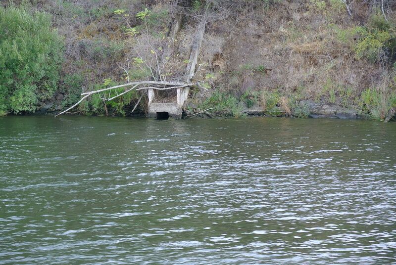 DC 22-0796-037.jpg :: Saga Douro River Cruise, Barca d'Alva to Pocinho, Portugal: View from the MS Douro Spirit, sailing down the River Douro in the Urros region. Water drainage into the river. Photo taken 01/09/2022