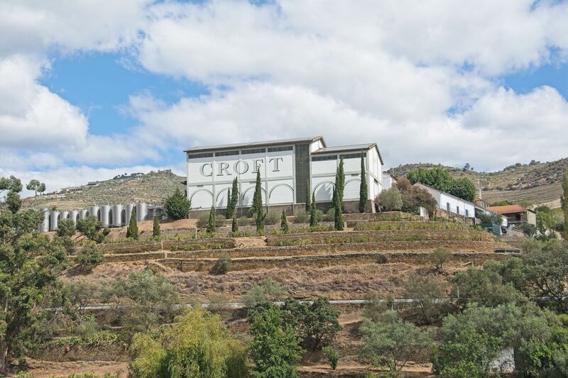DC 22-0797-059.jpg :: Saga Douro River Cruise, Pocinho to Pinhao, River Douro: Quinta da Roêda, the famous wine-growing estate owned by the Port house Croft. Croft is one of the oldest active Port wine producers, founded in 1588. The wines from this property form the core of Croft's Vintage Port blends. The estate is known for its distinctive terraced vineyards, which have been used for growing grapes for centuries. Photo taken 02/09/2022