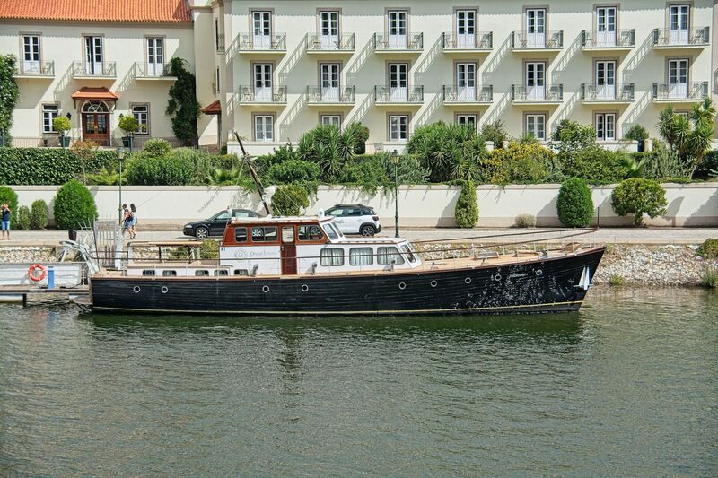 DC 22-0797-083.jpg :: Saga Douro River Cruise, Pocinho to Pinhao, River Douro: The vintage wooden yacht Friendship I and the Vintage House Douro hotel in Pinhão, Portugal. The vessel is a 66-foot classic \