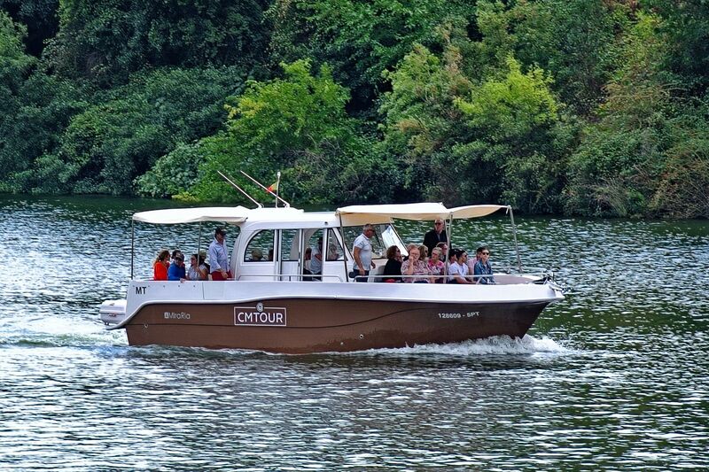 DC 22-0797-099.jpg :: Saga Douro River Cruise, Pocinho to Pinhao, River Douro: The smaller vessel in the foreground is a tour boat operated by CMTOUR. The tour boat offers shorter, regional trips and experiences operating out of Pinhao. Photo taken 02/09/2022