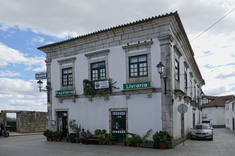 DC 22-0808-010.jpg :: Saga Douro River Cruise, Favaios:  The building in the image is a commercial establishment located in Favaios, Portugal, which operates as a Papelaria e Tabacaria (stationery and tobacco shop), also offering books as a Livraria (bookstore). Photo taken 02/09/2022