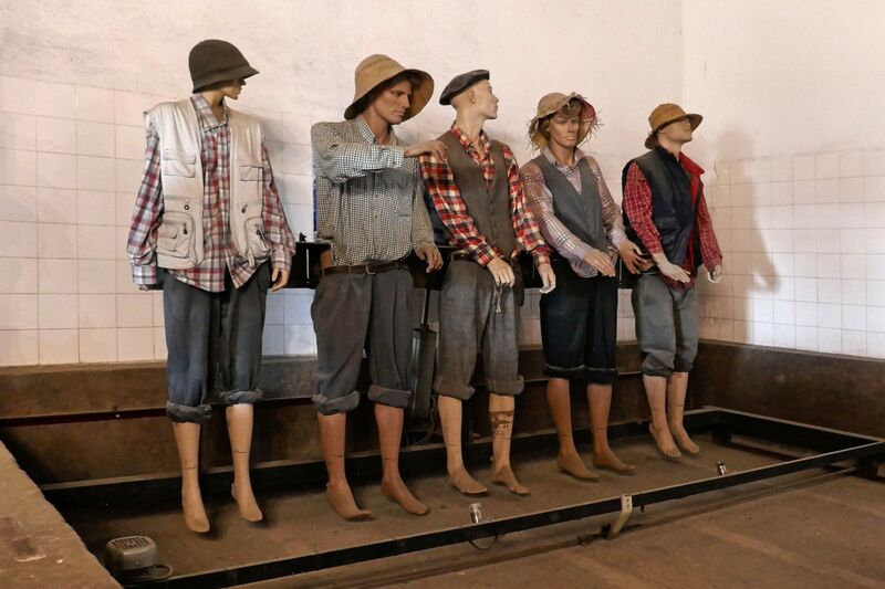 DC 22-0808-069.jpg :: Saga Douro River Cruise, Favaios, Avessada Wine Estate: Quinta da Avessada is located in the centre of the Douro demarcated region at its highest point (at an altitude of 600 meters) and the flattest point in the whole region (about 1,000ha of plateau), consisting of four buildings (one of them is one hundred years old) and 25ha of planting. Due to this, 90% of its plantation is destined to the production of Muscat grapes, with which Moscatel de Favaios is produced, and is designated a national apéritif. It is the Wine-Growing Village of Favaios. Model; re-enactment of grape tread crush workers. Photo taken 02/09/2022