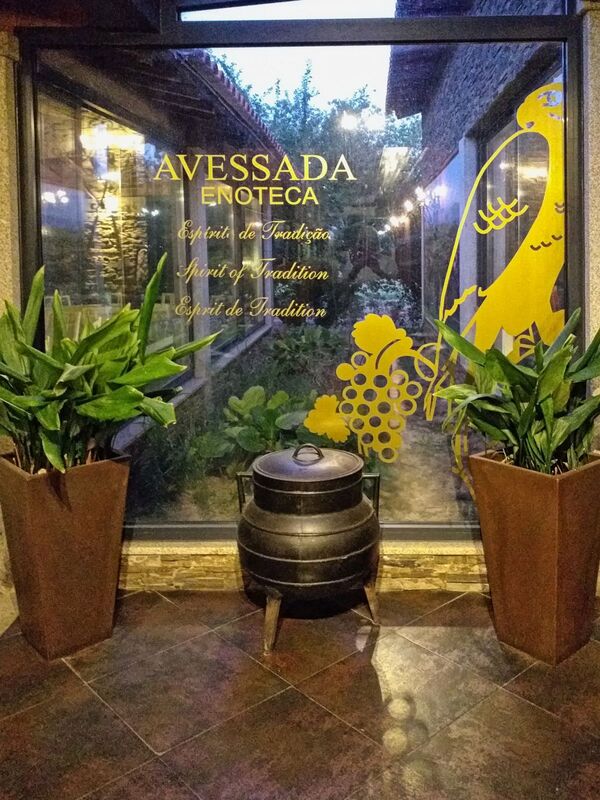 DC 22-0808-083.jpg :: Saga Douro River Cruise, Favaios, Avessada Wine Estate: Quinta da Avessada is located in the centre of the Douro demarcated region at its highest point (at an altitude of 600 meters) and the flattest point in the whole region (about 1,000ha of plateau), consisting of four buildings (one of them is one hundred years old) and 25ha of planting. Due to this, 90% of its plantation is destined to the production of Muscat grapes, with which Moscatel de Favaios is produced, and is designated a national apéritif. It is the Wine-Growing Village of Favaios. Winery entrance. Photo taken 02/09/2022