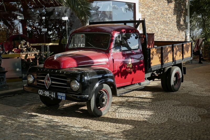 DC 22-0808-086.jpg :: Saga Douro River Cruise, Favaios, Avessada Wine Estate: Quinta da Avessada is located in the centre of the Douro demarcated region at its highest point (at an altitude of 600 meters) and the flattest point in the whole region (about 1,000ha of plateau), consisting of four buildings (one of them is one hundred years old) and 25ha of planting. Due to this, 90% of its plantation is destined to the production of Muscat grapes, with which Moscatel de Favaios is produced, and is designated a national apéritif. It is the Wine-Growing Village of Favaios. Borgward grape delivery truck. Photo taken 02/09/2022