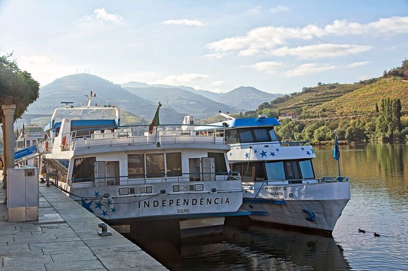 DC 22-0809-001.jpg :: Saga Douro River Cruise, Pinhao to Regua, Portugal: The MS Douro Spirit berthed at Regua after sailing through the night from Pinhao. Other Douro cruise ships berthed in front of the Douro Spirit. Photo taken 03/09/2022
