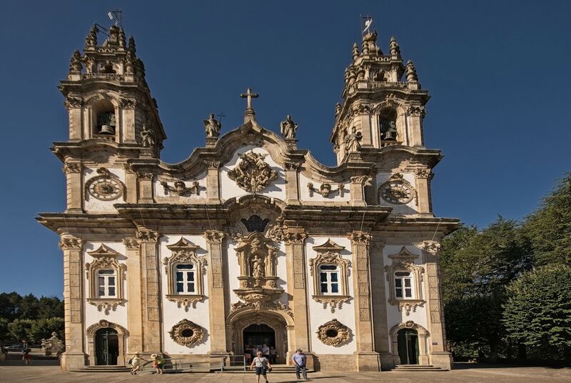 DC 22-0810-002.jpg :: Saga Douro River Cruise, Santuario de Nossa Senhora dos Remedios and Regua: The Santuário de Nossa Senhora dos Remédios (Sanctuary of Our Lady of Remedies), a famous pilgrimage site and 18th-century Baroque sanctuary in Lamego, Portugal. The sanctuary is a prominent example of Baroque-style architecture, known for its highly ornate and detailed façade. The site's most iconic feature is a magnificent zigzagging staircase leading up to the church. It consists of 686 steps across nine terraces. The complex is embellished with decorative fountains, statues, and terraced gardens at each level of the staircase. One notable fountain outside is said by some to have healing waters. It is situated atop the Hill of St. Stephen (Monte de Santo Estêvão), offering panoramic views of the town of Lamego and the surrounding Douro Valley. Construction of the present Baroque shrine began in the mid-18th century, though the site has earlier religious roots as a hermitage. Today, it remains one of the major pilgrimage centres in Portugal, where pilgrims traditionally climb the hundreds of steps as an act of reflection and meditation. Photo taken 03/09/2022