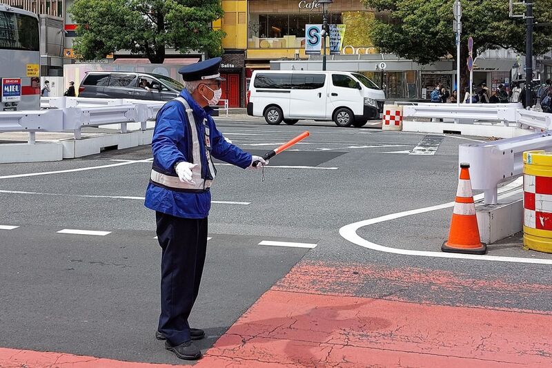 DC 23-0677-032.jpg :: Iglu Tour, Ultimate Japan & Cherry Blossom: Tokyo, Japan, Traffic controller. located outside Tokyo's Shibuya Station. Photo taken 31/03/2023