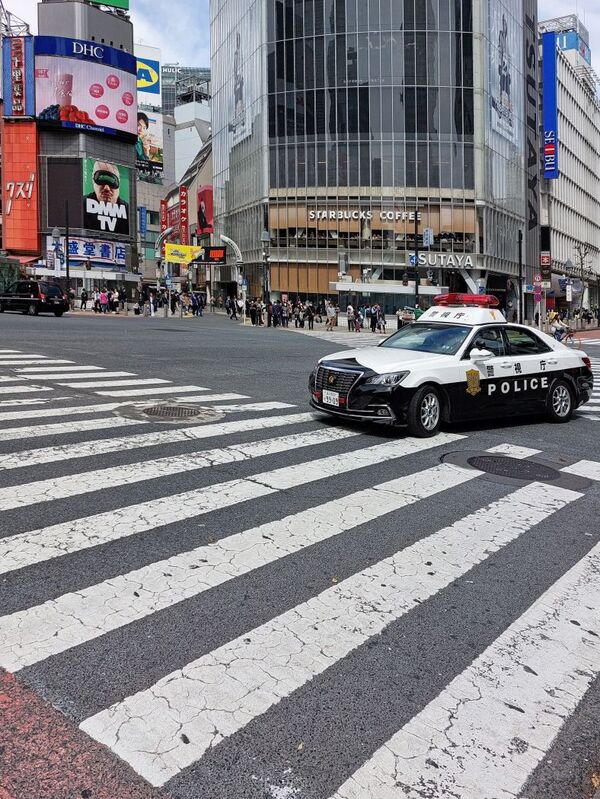 DC 23-0677-035.jpg :: Iglu Tour, Ultimate Japan & Cherry Blossom: Tokyo, Japan, The most famous pedestrian crossing in Tokyo is the Shibuya Crossing, also known as the Shibuya Scramble Crossing. It's the world's busiest pedestrian crossing, with thousands of people crossing simultaneously when the lights turn red for cars. This iconic landmark is located in front of Shibuya Station's Hachiko exit and is a must-see for any visitor to Tokyo. Photo taken 31/03/2023