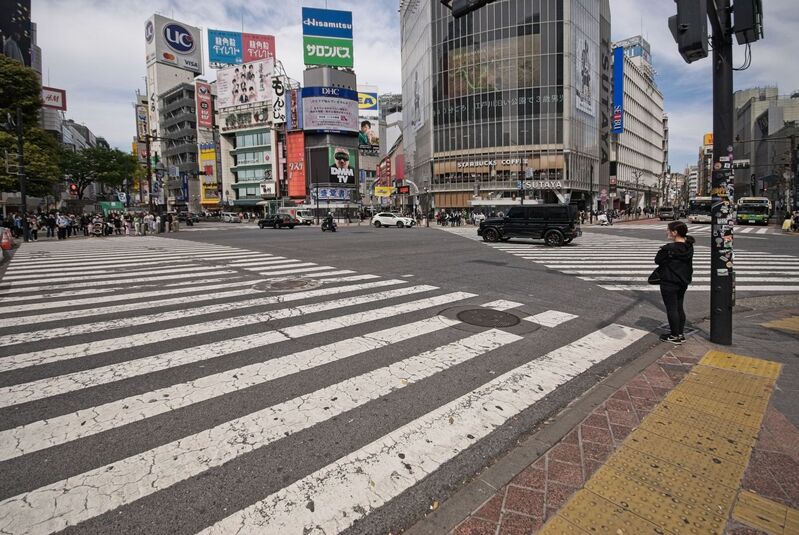 DC 23-0677-049.jpg :: Iglu Tour, Ultimate Japan & Cherry Blossom: Tokyo, Japan. The most famous pedestrian crossing in Tokyo is the Shibuya Crossing, also known as the Shibuya Scramble Crossing. It's the world's busiest pedestrian crossing, with thousands of people crossing simultaneously when the lights turn red for cars. This iconic landmark is located in front of Shibuya Station's Hachiko exit and is a must-see for any visitor to Tokyo. Photo taken 31/03/2023