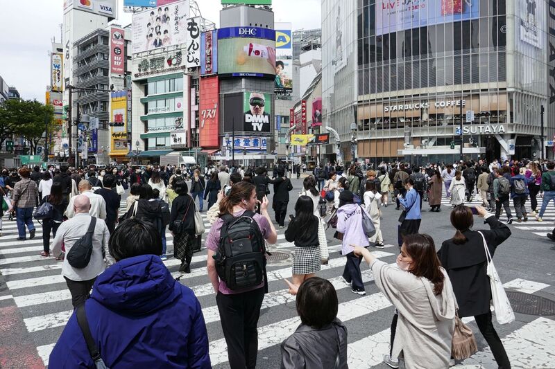 DC 23-0677-062.jpg :: Iglu Tour, Ultimate Japan & Cherry Blossom: Tokyo, Japan. The most famous pedestrian crossing in Tokyo is the Shibuya Crossing, also known as the Shibuya Scramble Crossing. It's the world's busiest pedestrian crossing, with thousands of people crossing simultaneously when the lights turn red for cars. This iconic landmark is located in front of Shibuya Station's Hachiko exit and is a must-see for any visitor to Tokyo. Photo taken 31/03/2023
