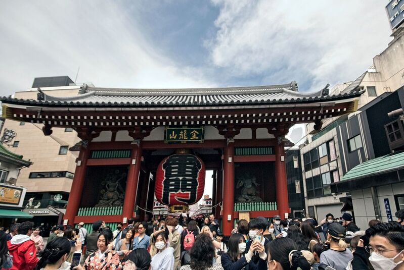 DC 23-0677-072.jpg :: Iglu Tour, Ultimate Japan & Cherry Blossom: Tokyo, Japan. Senso-ji, widely known as Asakusa Kannon Temple, is Tokyo’s oldest Buddhist temple. Located in Asakusa, one of Tokyo’s most lively and busy districts, Senso-ji is one of the most visited spiritual sites in the world. This bright and colourful temple attracts so many people from all over the world that at times it’s even hard to walk around the temple grounds. Senso-ji was founded almost one and half millennia ago, in 645. The legend says that in 628 two fishermen caught a statue of Kannon, the goddess of compassion, in the nearby Sumida River. They tried to get rid of it, but it kept coming back to them. Taking it as a sign, the head of the fishermen’s village erected Senso-ji in honour of Kannon. The temple holds the original Kannon statue; however it can never be seen by the public and is supposedly stored safely inside 3 boxes. P.s. Kaminarimon Gate – first gate. The first of two gates leading to Senso-ji is Kaminarimon Gate, also known as “Thunder Gate”. The gate was first constructed in 941, and was originally located south of its current location in the Komagata area. In 1635 the gate was reconstructed closer to the temple where it can be seen today. The gate seen today is not the original one though – it has suffered under many fires over the years. The original gate burned a few years after its installation and was only rebuilt by a Tokugawa Shogun in 1649. In the 1700’s and 1800’s the gate burned to the ground a few times. The gate you see today was built in 1960. Photo taken 31/03/2023