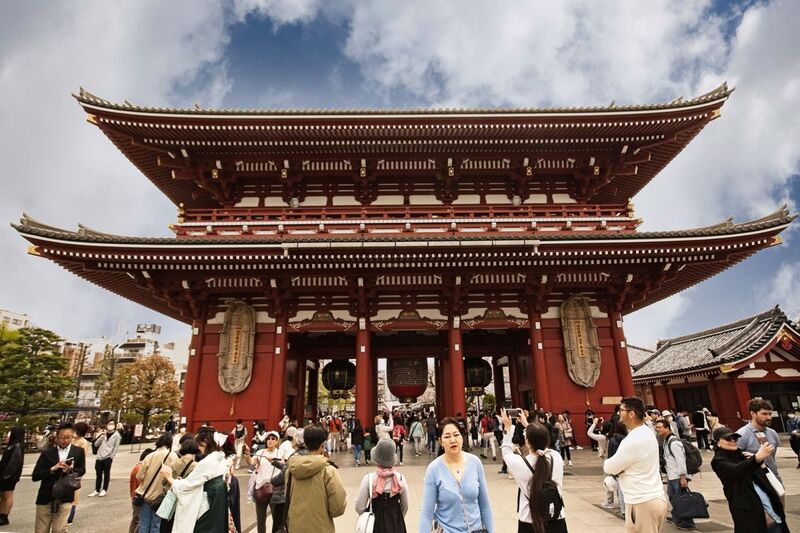 DC 23-0677-086.jpg :: Iglu Tour, Ultimate Japan & Cherry Blossom: Tokyo, Japan. Senso-ji, widely known as Asakusa Kannon Temple, is Tokyo’s oldest Buddhist temple. Located in Asakusa, one of Tokyo’s most lively and busy districts, Senso-ji is one of the most visited spiritual sites in the world. This bright and colourful temple attracts so many people from all over the world that at times it’s even hard to walk around the temple grounds. Senso-ji was founded almost one and half millennia ago, in 645. The legend says that in 628 two fishermen caught a statue of Kannon, the goddess of compassion, in the nearby Sumida River. They tried to get rid of it, but it kept coming back to them. Taking it as a sign, the head of the fishermen’s village erected Senso-ji in honor of Kannon. The temple holds the original Kannon statue; however it can never be seen by the public and is supposedly stored safely inside 3 boxes. P.s. Hozomon Gate – second gate. The second gate “Hozomon” leading to Senso-ji temple is also known as “Treasure-house gate”. The gate has a very unique look with it’s two floors. On the second floor, many of the temples treasures are stored, hence the name “Treasure-house gate”. The gate is decorated with three large lanterns and is protected by two Nio statues on the front face. The backside displays two large straw sandals. Like the Kaminarimon Gate this gate was also burned down and rebuilt on several occasions over the years. The current gate is from 1964 and is built in reinforced concrete and fire-resistant materials. At the back of the Hozomon gate you will most likely notice the two gigantic straw sandals hung up on the wall. Many questions pop into mind here. Firstly, why sandals? secondly why so big? Strange as this may seem today, sandals have been common offerings for temples when people came to pray. The explanation of the sandals apparently is that people would pray for their legs and lower body, as this part of the body was crucial for being able to work hence earn for food. The large size of the sandals is not common though. There appears to be a few different stories of why the sandals are there, but common for all the stories is that the huge sandals are offered to Senso-ji temple by the city of Maruyama in Yamagata, some 400km / 250mi from Tokyo. Every 10 years the city gets together and create a new pair of sandals which are donated to Senso-ji. Photo taken 31/03/2023