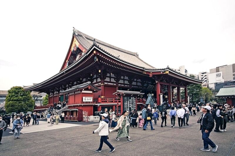 DC 23-0677-111.jpg :: Iglu Tour, Ultimate Japan & Cherry Blossom: Tokyo, Japan. Senso-ji, widely known as Asakusa Kannon Temple, is Tokyo’s oldest Buddhist temple. Located in Asakusa, one of Tokyo’s most lively and busy districts, Senso-ji is one of the most visited spiritual sites in the world. This bright and colourful temple attracts so many people from all over the world that at times it’s even hard to walk around the temple grounds. Senso-ji was founded almost one and half millennia ago, in 645. The legend says that in 628 two fishermen caught a statue of Kannon, the goddess of compassion, in the nearby Sumida River. They tried to get rid of it, but it kept coming back to them. Taking it as a sign, the head of the fishermen’s village erected Senso-ji in honour of Kannon. The temple holds the original Kannon statue; however, it can never be seen by the public and is supposedly stored safely inside 3 boxes. Photo taken 31/03/2023