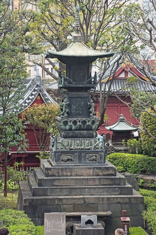 DC 23-0677-118.jpg :: Iglu Tour, Ultimate Japan & Cherry Blossom: Tokyo, Japan. Senso-ji, widely known as Asakusa Kannon Temple, is Tokyo’s oldest Buddhist temple. Located in Asakusa, one of Tokyo’s most lively and busy districts, Senso-ji is one of the most visited spiritual sites in the world. This bright and colourful temple attracts so many people from all over the world that at times it’s even hard to walk around the temple grounds. Senso-ji was founded almost one and half millennia ago, in 645. The legend says that in 628 two fishermen caught a statue of Kannon, the goddess of compassion, in the nearby Sumida River. They tried to get rid of it, but it kept coming back to them. Taking it as a sign, the head of the fishermen’s village erected Senso-ji in honor of Kannon. The temple holds the original Kannon statue; however, it can never be seen by the public and is supposedly stored safely inside 3 boxes. P.s. A Bronze Hokyoin-to in Sensoji Temple garden. Photo taken 31/03/2023