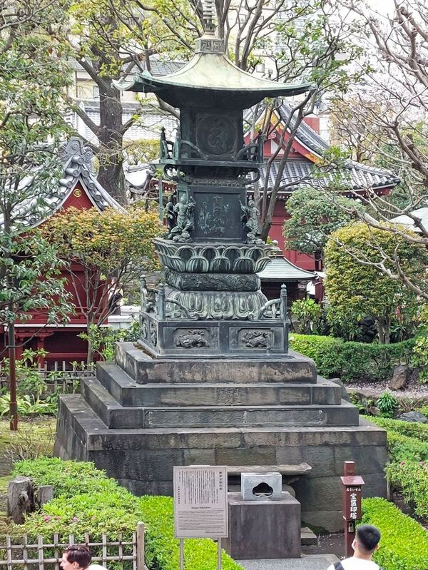 DC 23-0677-120.jpg :: Iglu Tour, Ultimate Japan & Cherry Blossom: Tokyo, Japan. Senso-ji, widely known as Asakusa Kannon Temple, is Tokyo’s oldest Buddhist temple. Located in Asakusa, one of Tokyo’s most lively and busy districts, Senso-ji is one of the most visited spiritual sites in the world. This bright and colourful temple attracts so many people from all over the world that at times it’s even hard to walk around the temple grounds. Senso-ji was founded almost one and half millennia ago, in 645. The legend says that in 628 two fishermen caught a statue of Kannon, the goddess of compassion, in the nearby Sumida River. They tried to get rid of it, but it kept coming back to them. Taking it as a sign, the head of the fishermen’s village erected Senso-ji in honor of Kannon. The temple holds the original Kannon statue; however, it can never be seen by the public and is supposedly stored safely inside 3 boxes. P.s. A Bronze Hokyoin-to in Sensoji Temple garden. Photo taken 31/03/2023