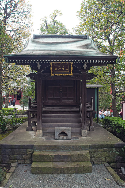 DC 23-0677-136.jpg :: Iglu Tour, Ultimate Japan & Cherry Blossom: Tokyo, Japan. Senso-ji, widely known as Asakusa Kannon Temple, is Tokyo’s oldest Buddhist temple. Located in Asakusa, one of Tokyo’s most lively and busy districts, Senso-ji is one of the most visited spiritual sites in the world. This bright and colourful temple attracts so many people from all over the world that at times it’s even hard to walk around the temple grounds. Senso-ji was founded almost one and half millennia ago, in 645. The legend says that in 628 two fishermen caught a statue of Kannon, the goddess of compassion, in the nearby Sumida River. They tried to get rid of it, but it kept coming back to them. Taking it as a sign, the head of the fishermen’s village erected Senso-ji in honour of Kannon. The temple holds the original Kannon statue; however, it can never be seen by the public and is supposedly stored safely inside 3 boxes. P.s. Miho Shrine, located at Sensoji Temple garden. Photo taken 31/03/2023