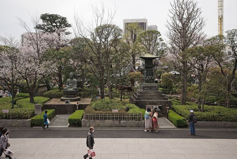 DC 23-0677-139.jpg :: Iglu Tour, Ultimate Japan & Cherry Blossom: Tokyo, Japan. Senso-ji, widely known as Asakusa Kannon Temple, is Tokyo’s oldest Buddhist temple. Located in Asakusa, one of Tokyo’s most lively and busy districts, Senso-ji is one of the most visited spiritual sites in the world. This bright and colourful temple attracts so many people from all over the world that at times it’s even hard to walk around the temple grounds. Senso-ji was founded almost one and half millennia ago, in 645. The legend says that in 628 two fishermen caught a statue of Kannon, the goddess of compassion, in the nearby Sumida River. They tried to get rid of it, but it kept coming back to them. Taking it as a sign, the head of the fishermen’s village erected Senso-ji in honour of Kannon. The temple holds the original Kannon statue; however, it can never be seen by the public and is supposedly stored safely inside 3 boxes. P.s. Meditating Buddha and Hokyoin-to. Photo taken 31/03/2023