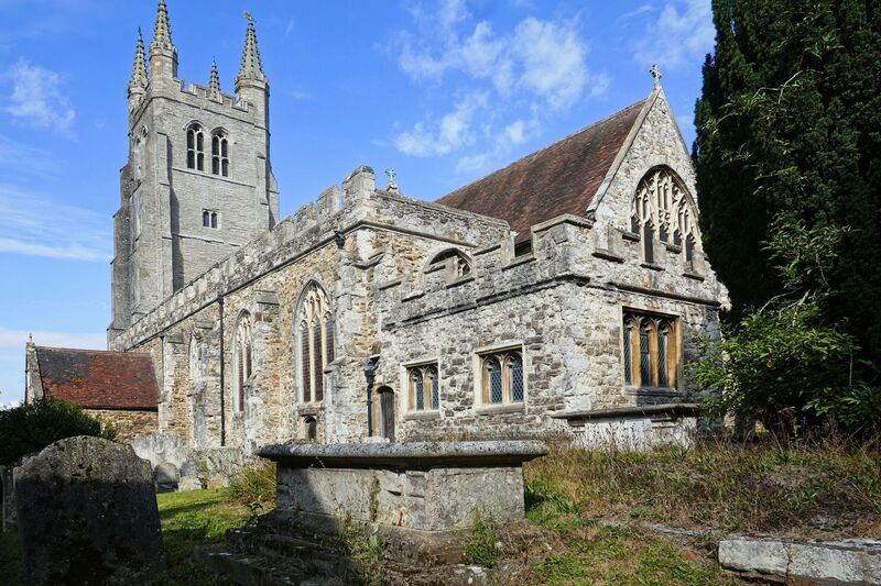 DC 24-0736-003.jpg :: Tenterden, Kent: St. Mildred's Church is an Anglican church located in Tenterden in the borough of Ashford in Kent. The church dates from about the 12th century and is Grade I heritage listed. The main tower of the church is 39.6 metres (130 feet) high and was constructed in 1461. It is dedicated to a prominent Anglo-Saxon saint, Saint Mildred, a 7th-century princess who served as the abbess of the nunnery at Minister-in-Thanet. The main tower of the church is built from Bethersden Marble, a limestone that contains thousands of brightly coloured shells. A graveyard is also present on the left-hand side of the church. Photo taken 04/09/2024