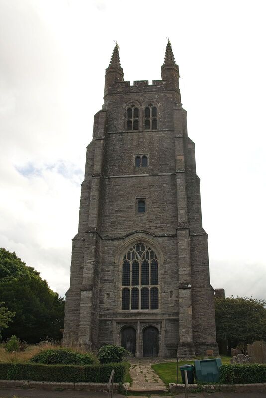 DC 24-0736-012.jpg :: Tenterden, Kent: St. Mildred's Church is an Anglican church located in Tenterden in the borough of Ashford in Kent. The church dates from about the 12th century and is Grade I heritage listed. The main tower of the church is 39.6 metres (130 feet) high and was constructed in 1461. It is dedicated to a prominent Anglo-Saxon saint, Saint Mildred, a 7th-century princess who served as the abbess of the nunnery at Minister-in-Thanet. The main tower of the church is built from Bethersden Marble, a limestone that contains thousands of brightly coloured shells. A graveyard is also present on the left-hand side of the church. Photo taken 04/09/2024