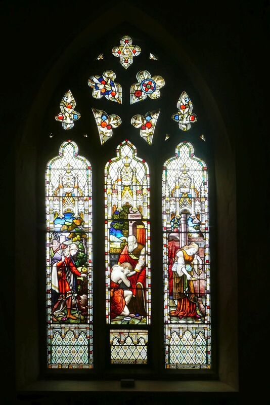 DC 24-0736-021.jpg :: Tenterden, Kent: St. Mildred's Church is an Anglican church located in Tenterden in the borough of Ashford in Kent. The church dates from about the 12th century and is Grade I heritage listed. The main tower of the church is 39.6 metres (130 feet) high and was constructed in 1461. It is dedicated to a prominent Anglo-Saxon saint, Saint Mildred, a 7th-century princess who served as the abbess of the nunnery at Minister-in-Thanet. The main tower of the church is built from Bethersden Marble, a limestone that contains thousands of brightly coloured shells. A graveyard is also present on the left-hand side of the church. Stained glass windows, Good Shepherd, Prodigal Son and Lost Penny by Ward & Hughes 1884. Photo taken 04/09/2024