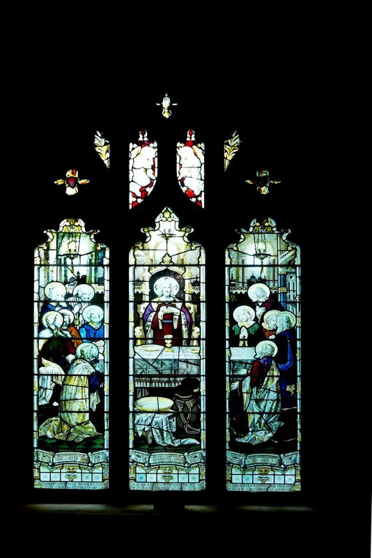 DC 24-0736-028.jpg :: Tenterden, Kent: St. Mildred's Church is an Anglican church located in Tenterden in the borough of Ashford in Kent. The church dates from about the 12th century and is Grade I heritage listed. The main tower of the church is 39.6 metres (130 feet) high and was constructed in 1461. It is dedicated to a prominent Anglo-Saxon saint, Saint Mildred, a 7th-century princess who served as the abbess of the nunnery at Minister-in-Thanet. The main tower of the church is built from Bethersden Marble, a limestone that contains thousands of brightly coloured shells. A graveyard is also present on the left-hand side of the church. Stained glass window. Skelding & Waterman Window. TF Curtis, Ward & Hughes 1906 Photo taken 04/09/2024