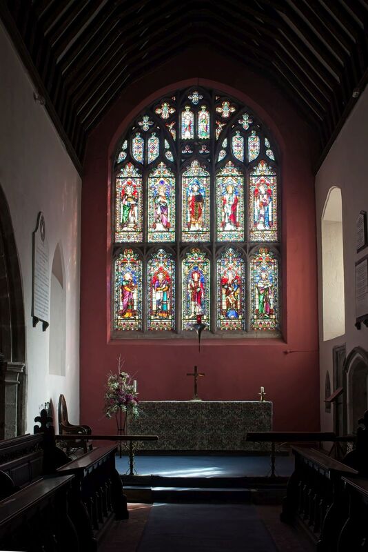 DC 24-0736-031.jpg :: Tenterden, Kent: St. Mildred's Church is an Anglican church located in Tenterden in the borough of Ashford in Kent. The church dates from about the 12th century and is Grade I heritage listed. The main tower of the church is 39.6 metres (130 feet) high and was constructed in 1461. It is dedicated to a prominent Anglo-Saxon saint, Saint Mildred, a 7th-century princess who served as the abbess of the nunnery at Minister-in-Thanet. The main tower of the church is built from Bethersden Marble, a limestone that contains thousands of brightly coloured shells. A graveyard is also present on the left-hand side of the church. Stained glass window. Upper Lights- Matthew, Mark, Christ as Salvator Mund, Luke, John   Lower Lights- Isaiah, Jeremiah, John the Baptist, Ezekiel, Daniel. -  Lavers & Barraud 1864. Photo taken 04/09/2024