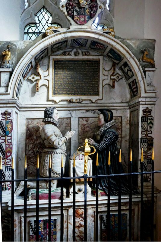 DC 24-0736-037.jpg :: Tenterden, Kent: St. Mildred's Church is an Anglican church located in Tenterden in the borough of Ashford in Kent. The church dates from about the 12th century and is Grade I heritage listed. The main tower of the church is 39.6 metres (130 feet) high and was constructed in 1461. It is dedicated to a prominent Anglo-Saxon saint, Saint Mildred, a 7th-century princess who served as the abbess of the nunnery at Minister-in-Thanet. The main tower of the church is built from Bethersden Marble, a limestone that contains thousands of brightly coloured shells. A graveyard is also present on the left-hand side of the church. Whitfield memorial to Herbert Whitfield and his wife Matha. Photo taken 04/09/2024