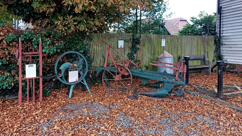 DC 24-0736-066.jpg :: Tenterden, Kent: Tenterden & District Museum: Agricultural artifacts. On view a 40 gallon paraffin tank, Ramsomes (Ipswich) Three Furrow Stubble Breaker, Bentall CPB Chaff Cutter and Sack Lifter (Lewis & Sons, Kettering). Photo taken 04/09/2024
