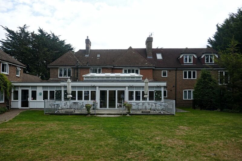 DC 24-0736-073.jpg :: Tenterden, Kent: Little Silver Country Hotel, a former 16 bedroom hotel and wedding venue on Ashford Road in Tenterden. The main part of the property features a mock-Tudor façade and dates back to the mid 20th century. and terrace at rear of the hotel. Photo taken 04/09/2024