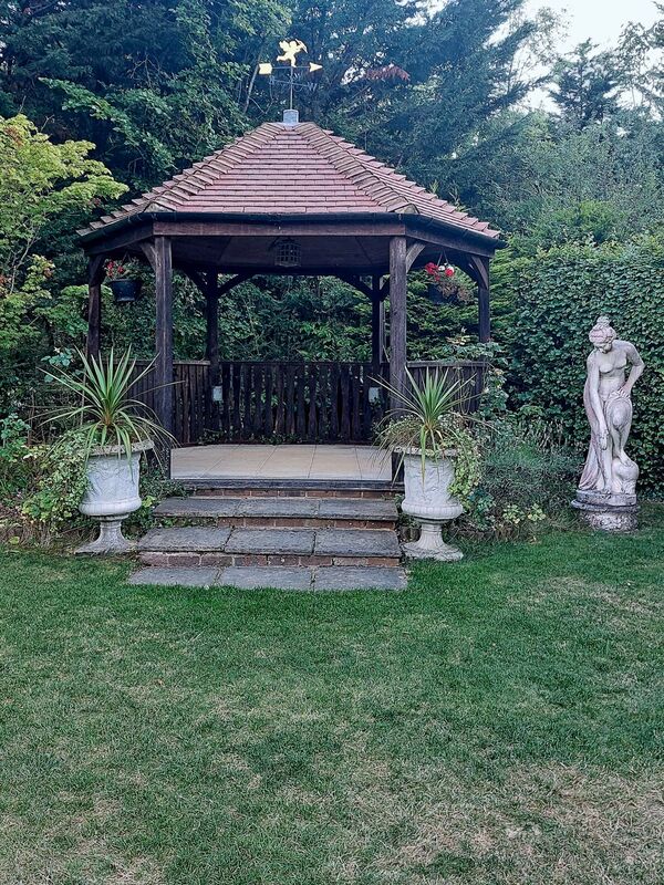 DC 24-0736-077.jpg :: Tenterden, Kent: Little Silver Country Hotel, a former 16-bedroom hotel and wedding venue on Ashford Road in Tenterden. The main part of the property features a mock-Tudor façade and dates back to the mid-20th century. Garden Gazebo. Photo taken 04/09/2024