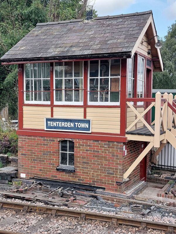 DC 24-0737-001.jpg :: Kent and East Sussex Railway: The Kent & East Sussex Railway (K&ESR) at Tenterden Town station features a signal box that is a significant part of the railway's heritage. The signal box, originally from Chilham, was restored in 1973 and still utilizes much of its original equipment. It plays a vital role in the K&ESR's operations, and the railway allows visitors to watch the signal box workings from the platform. Photo taken 04-09-2024