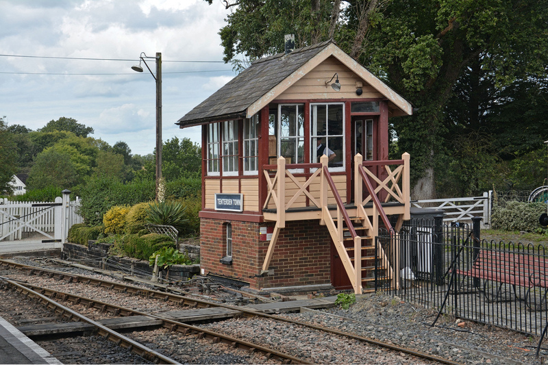 DC 24-0737-003.jpg :: Kent and East Sussex Railway: The Kent & East Sussex Railway (K&ESR) at Tenterden Town station features a signal box that is a significant part of the railway's heritage. The signal box, originally from Chilham, was restored in 1973 and still utilizes much of its original equipment. It plays a vital role in the K&ESR's operations, and the railway allows visitors to watch the signal box workings from the platform. Photo taken 04-09-2024