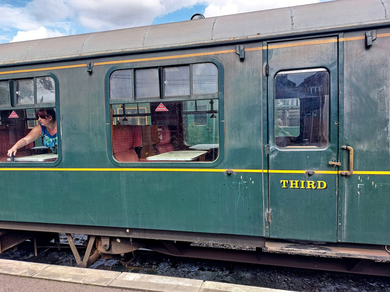 DC 24-0737-027.jpg :: Kent and East Sussex Railway: Tenterden Town Railway Station. British Railways Mk 1 TSO 3753, now K&ESR No.64. A British Railways Mk 1 TSO is a Tourist Second Open carriage, a type of passenger carriage built by British Railways as part of their standardized Mark 1 family. These coaches, introduced in the 1950s, are characterized by their open seating arrangement, typically arranged around tables, and are designed for second-class or standard-class travel. Photo taken 04-09-2024