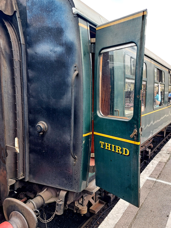 DC 24-0737-028.jpg :: Kent and East Sussex Railway: Tenterden Town Railway Station. British Railways Mk 1 TSO 3753, now K&ESR No.64. A British Railways Mk 1 TSO is a Tourist Second Open carriage, a type of passenger carriage built by British Railways as part of their standardized Mark 1 family. These coaches, introduced in the 1950s, are characterized by their open seating arrangement, typically arranged around tables, and are designed for second-class or standard-class travel. Photo taken 04-09-2024