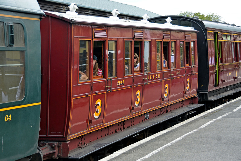 DC 24-0737-035.jpg :: Kent and East Sussex Railway: Tenterden Town Railway Station. Carriage 2947. This 40 seat, 2nd class vehicle was built by the SE&CR at Ashford in 1901 was a typical London suburban coach of the late Victorian era. In 1921 No. 2947 was withdrawn & the body sold for incorporation (with three other coach bodies) into a bungalow in Ashford, where it remained in use until 1986. This 40 seat, 2nd class vehicle was built by the SE&CR at Ashford in 1901 was a typical London suburban coach of the late Victorian era. In 1921 No. 2947 was withdrawn & the body sold for incorporation (with three other coach bodies) into a bungalow in Ashford, where it remained in use until 1986. The coach was well preserved and was acquired by the K&ESR for restoration, commencing in 1994. It entered service just one year and three days after restoration commenced. Photo taken 04-09-2024