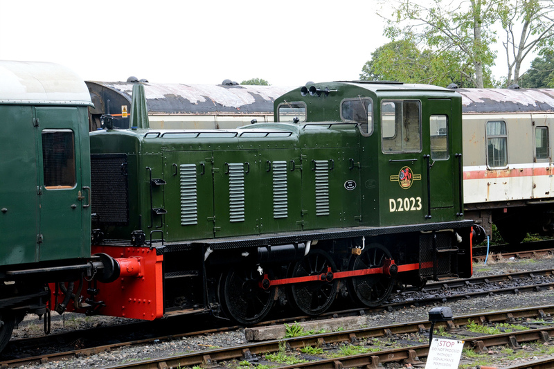 DC 24-0737-036.jpg :: Kent and East Sussex Railway: Tenterden Town Railway Station. D2023, Class 03. Two of these diminutive locos are on the K&ESR and have had a remarkably similar career. They were built at Swindon Works in 1958, to a similar design to those which were used on the Kent and East Sussex line during the final years of the BR freight service. D2023 quickly received a major overhaul and re-entered service in Brunswick green livery. It has taken an active part in operating the railway but is usually to be found at Tenterden Town as the shunt pilot locomotive. Photo taken 04-09-2024