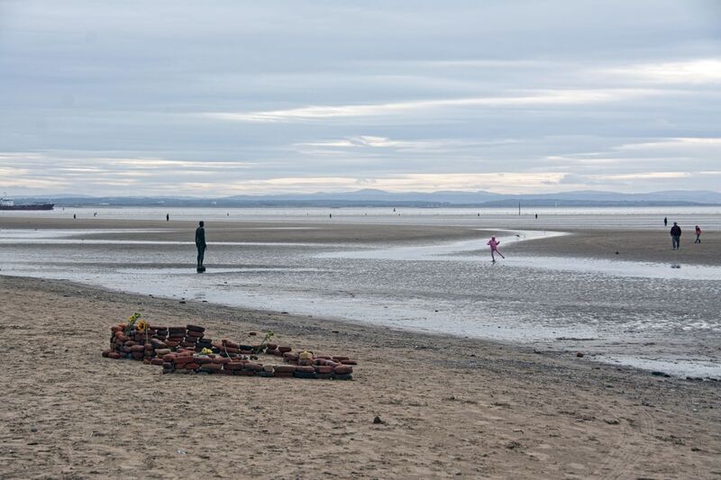 DC 24-0746-008.jpg :: Crosby Beach, Merseyside: Crosby Beach is part of the Merseyside coastline north of Liverpool in the Metropolitan Borough of Sefton, England, stretching about 2.5 miles (4.0 km) North-West from the Seaforth Dock in the Port of Liverpool, through Waterloo, where it separates the sea from the Marina. The beach was awarded Keep Britain Tidy's Quality Coast Award in 2011. Since 2007, the beach has been the permanent home of the Another Place sculptures by Antony Gormley. Photo taken 27/10/2024