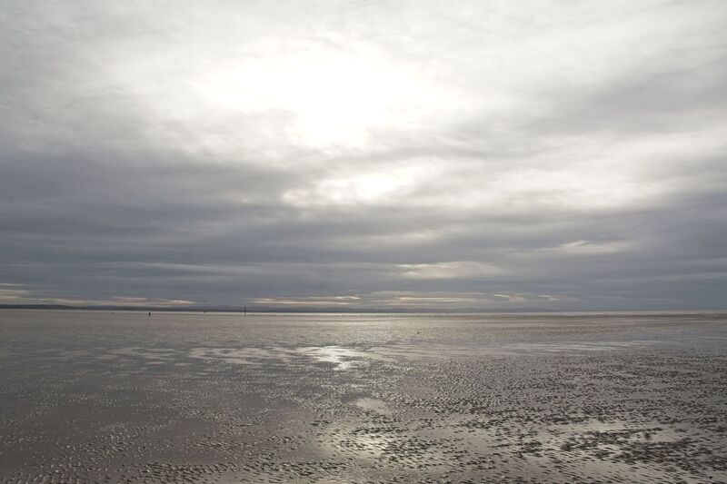DC 24-0746-013.jpg :: Crosby Beach, Merseyside: Crosby Beach is part of the Merseyside coastline north of Liverpool in the Metropolitan Borough of Sefton, England, stretching about 2.5 miles (4.0 km) North-West from the Seaforth Dock in the Port of Liverpool, through Waterloo, where it separates the sea from the Marina. The beach was awarded Keep Britain Tidy's Quality Coast Award in 2011. Since 2007, the beach has been the permanent home of the Another Place sculptures by Antony Gormley. Photo taken 27/10/2024