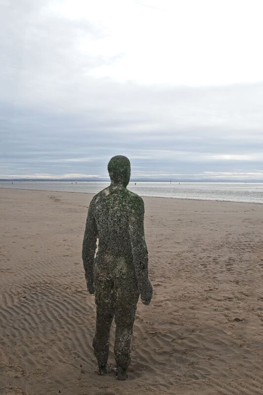 DC 24-0746-031.jpg :: Crosby Beech, Merseyside: Commonly referred to as ‘The Iron Men’ (or even the Crosby Beach statues), the art installation is officially called ‘Another Place’. Another Place was created by world-famous artist and sculptor Sir Antony Gormley, who famously created The Angel of the North. The Iron Men consist of 100 cast iron figures that have been installed along Crosby Beach facing the sea. The figures themselves are modelled from Antony Gormley’s body, and they were cast in the UK in both Halifax and West Bromwich. The Iron Men arrived in Liverpool in July 2005, but their story begins nearly 10 years earlier. In 1997, Another Place was first installed on Cuxhaven beach, in Lower Saxony, Germany. From there, they went to Stavanger in Norway and then to De Panne in Belgium. When The Iron Men found their new home at Crosby Beach in 2005, it was only supposed to be temporary. Photo taken 27/10/2024