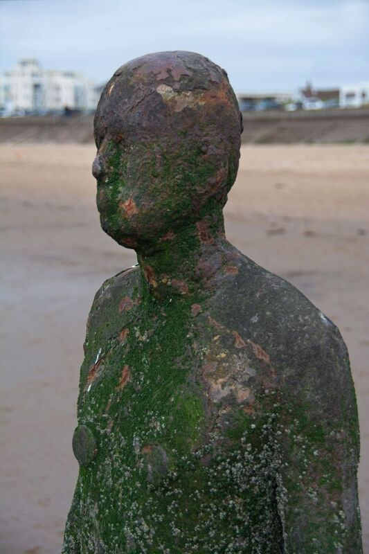 DC 24-0746-041.jpg :: Crosby Beech, Merseyside: Commonly referred to as ‘The Iron Men’ (or even the Crosby Beach statues), the art installation is officially called ‘Another Place’. Another Place was created by world-famous artist and sculptor Sir Antony Gormley, who famously created The Angel of the North. The Iron Men consist of 100 cast iron figures that have been installed along Crosby Beach facing the sea. The figures themselves are modelled from Antony Gormley’s body, and they were cast in the UK in both Halifax and West Bromwich. The Iron Men arrived in Liverpool in July 2005, but their story begins nearly 10 years earlier. In 1997, Another Place was first installed on Cuxhaven beach, in Lower Saxony, Germany. From there, they went to Stavanger in Norway and then to De Panne in Belgium. When The Iron Men found their new home at Crosby Beach in 2005, it was only supposed to be temporary. Photo taken 27/10/2024