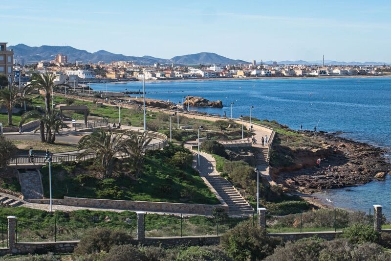 DC 24-0764-049.jpg :: Cabo de Palos, La Manga, Spain: Cabo de Palos is a cape in the Spanish municipality of Cartagena, in the region of Murcia. It is part of a small range of volcanic mounts that form a small peninsula. The Mediterranean islands of Grosa and the group known as the Hormigas Islands are part of this range, as well as the islands in the Mar Menor (“Little Sea”). The name Palos is derived from the Latin word palus, meaning ‘lagoon’, a reference to the Mar Menor. In the background La Manga strip. Photo taken 06/12/2024
