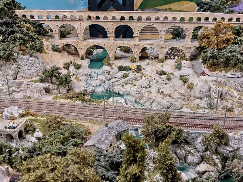 DC 25-0767-010.jpg :: Miniatur Wunderland Hamburg, Germany: The Miniatur Wunderland is, according to Guinness World Records, the largest model railway system in the world. It is located at the historic Speicherstadt in Hamburg and is one of the most popular and most visited sights in Germany. The exhibition includes around 1,230 digitally controlled trains with more than 12,000 wagons. The Wonderland is also designed with around 4,300 houses and bridges, more than 10,000 vehicles – of which around 350 drive independently on the installation – 47 airplanes and around 290,000 figures. The system features a recurring day-night lighting cycle and almost 500,000 built-in LED lights. Of the 7,000 m2 (75,347 sq ft) of floorspace, the models occupy 1,545 m2 (16,630 sq ft). P.s. Part of the Monaco section of the exhibition. Photo taken 20/01/2025