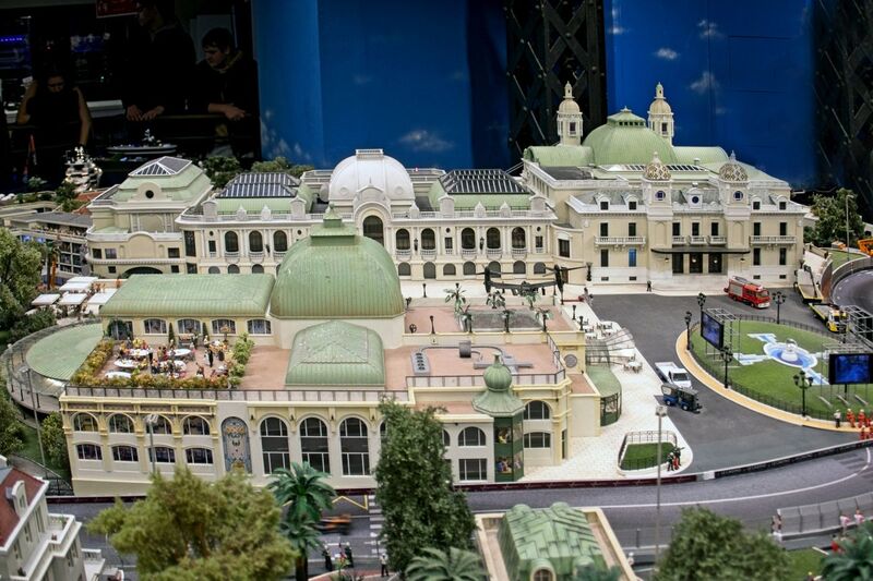 DC 25-0767-014.jpg :: Miniatur Wunderland Hamburg, Germany: The Miniatur Wunderland is, according to Guinness World Records, the largest model railway system in the world. It is located at the historic Speicherstadt in Hamburg and is one of the most popular and most visited sights in Germany. The exhibition includes around 1,230 digitally controlled trains with more than 12,000 wagons. The Wonderland is also designed with around 4,300 houses and bridges, more than 10,000 vehicles – of which around 350 drive independently on the installation – 47 airplanes and around 290,000 figures. The system features a recurring day-night lighting cycle and almost 500,000 built-in LED lights. Of the 7,000 m2 (75,347 sq ft) of floorspace, the models occupy 1,545 m2 (16,630 sq ft). P.s. Part of the Monaco section of the exhibition, Casino Square and race track. Photo taken 20/01/2025